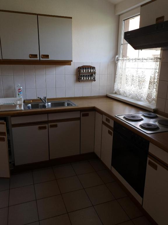 Kuchyňa alebo kuchynka v ubytovaní Apartamenty Drewniany Dom