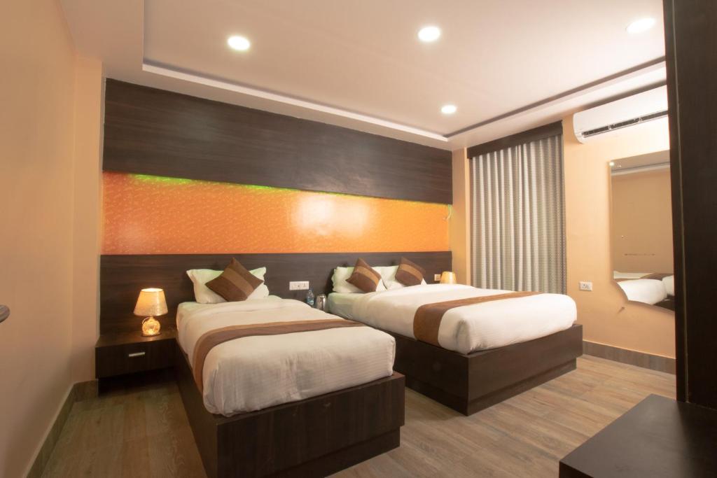 Voodi või voodid majutusasutuse Annapurna Hotel toas