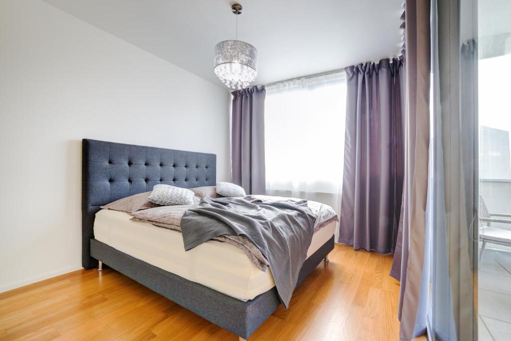 Postel nebo postele na pokoji v ubytování Mill Apartments