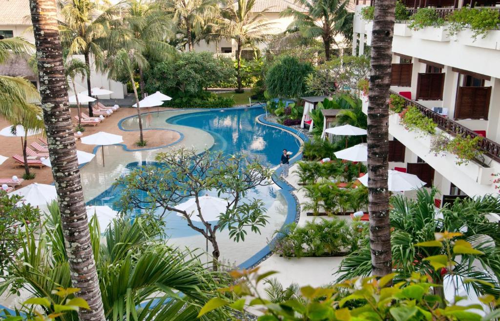 an overhead view of a resort pool with palm trees at Blu-Zea Resort by Double-Six in Seminyak