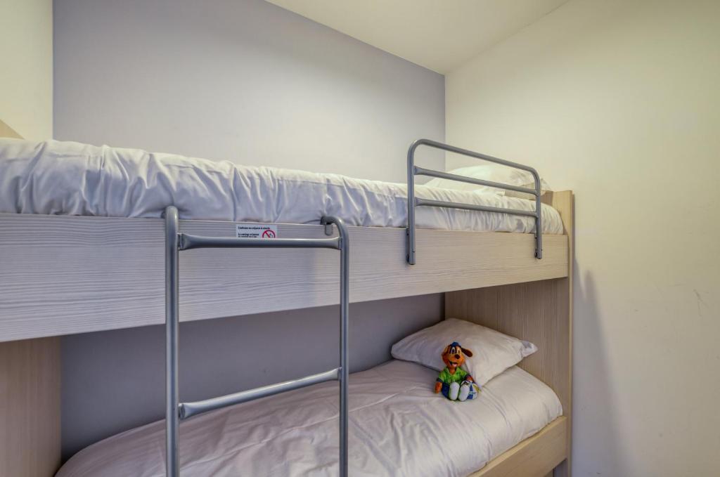 Postel nebo postele na pokoji v ubytování Evancy Etoile de Mer