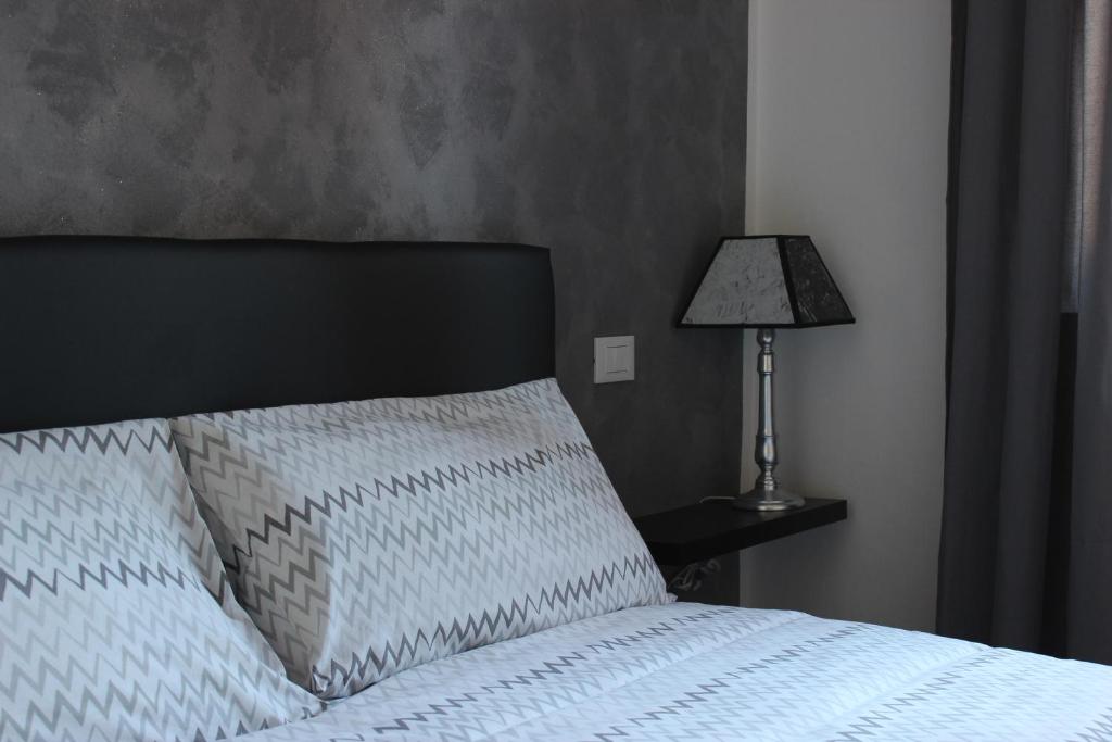 Postel nebo postele na pokoji v ubytování Residenza Guglielmo