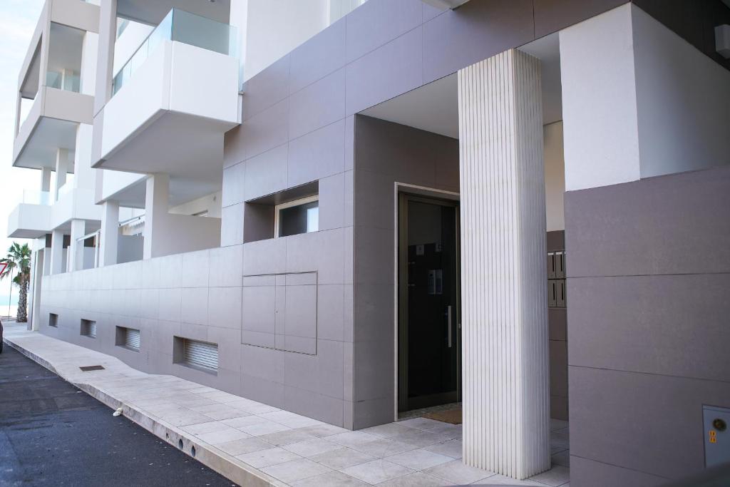 a facade of a building with a column at Terradamare in Monopoli