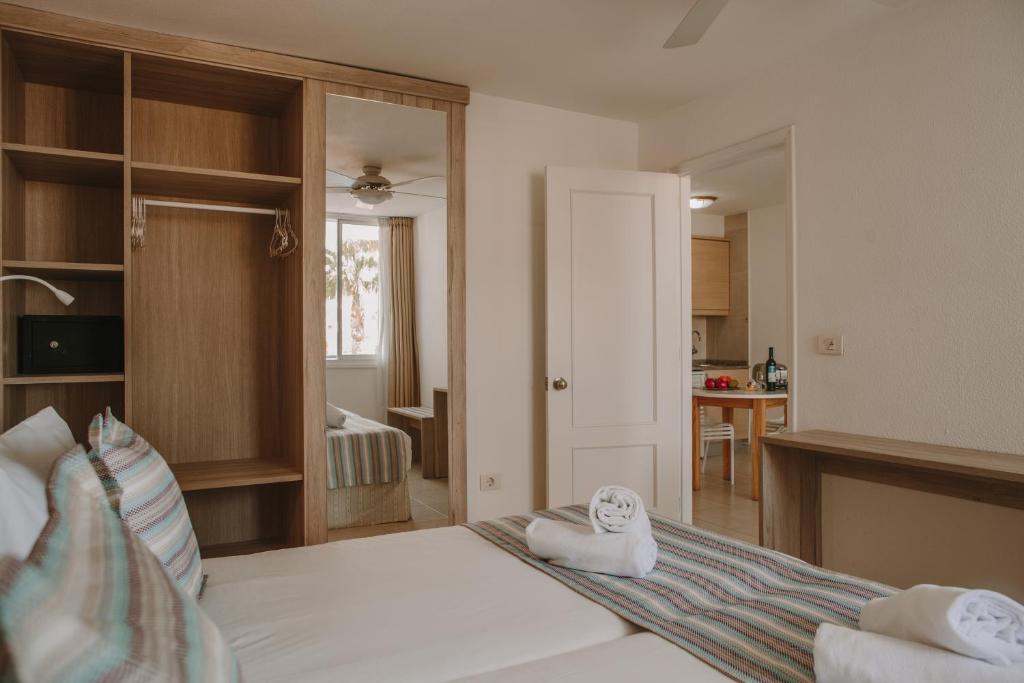 A bed or beds in a room at Playa Del Sol - Adults Only