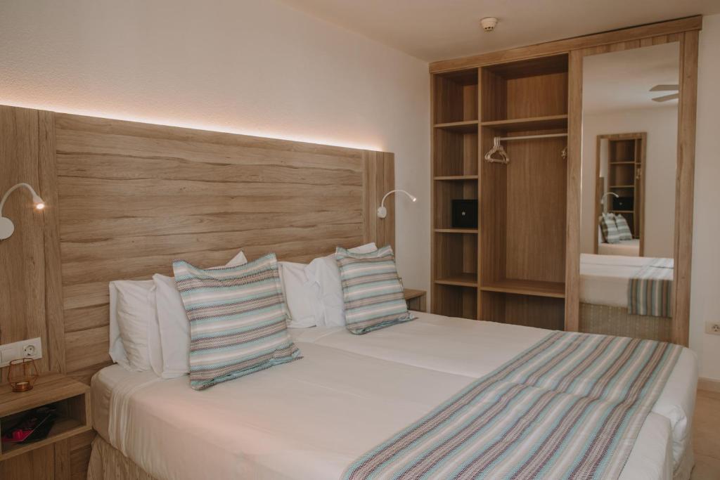 A bed or beds in a room at Playa Del Sol - Adults Only