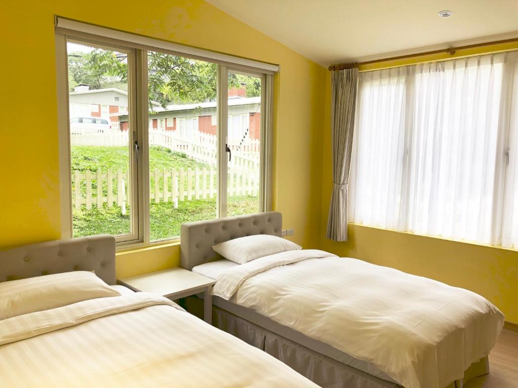 Postel nebo postele na pokoji v ubytování American Village Resort
