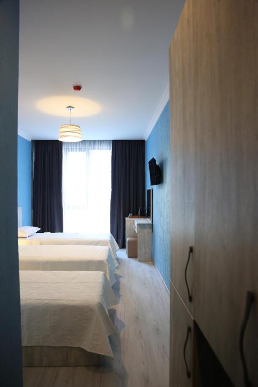 Postel nebo postele na pokoji v ubytování Hotel Soft