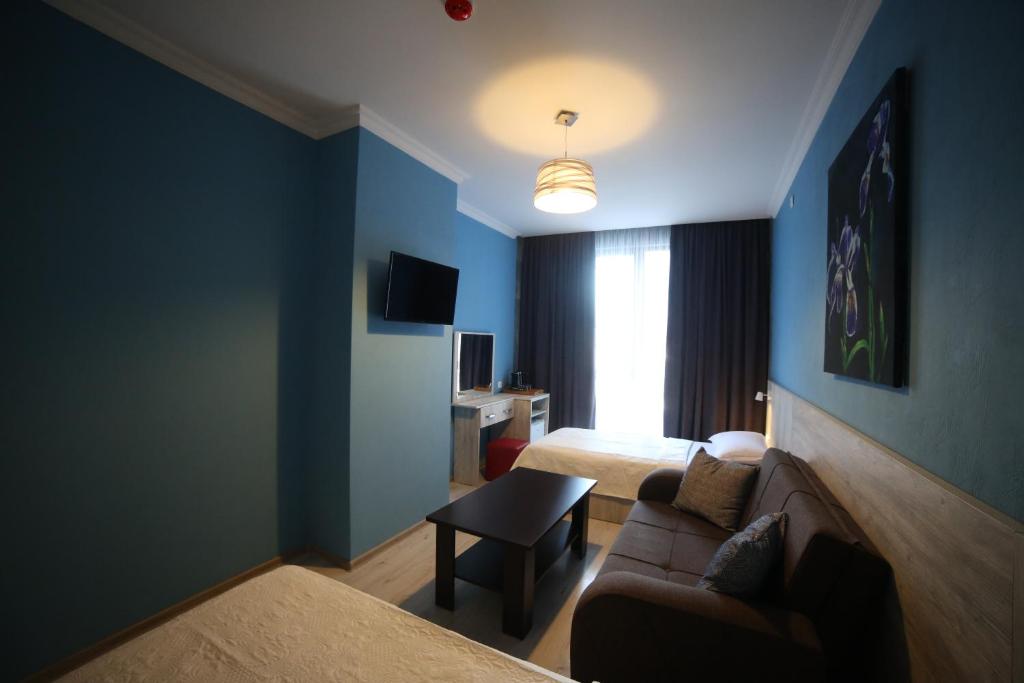 Postel nebo postele na pokoji v ubytování Hotel Soft