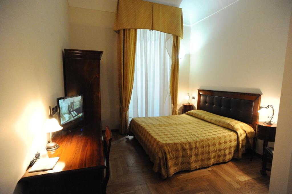 Postel nebo postele na pokoji v ubytování Residence Acropoli