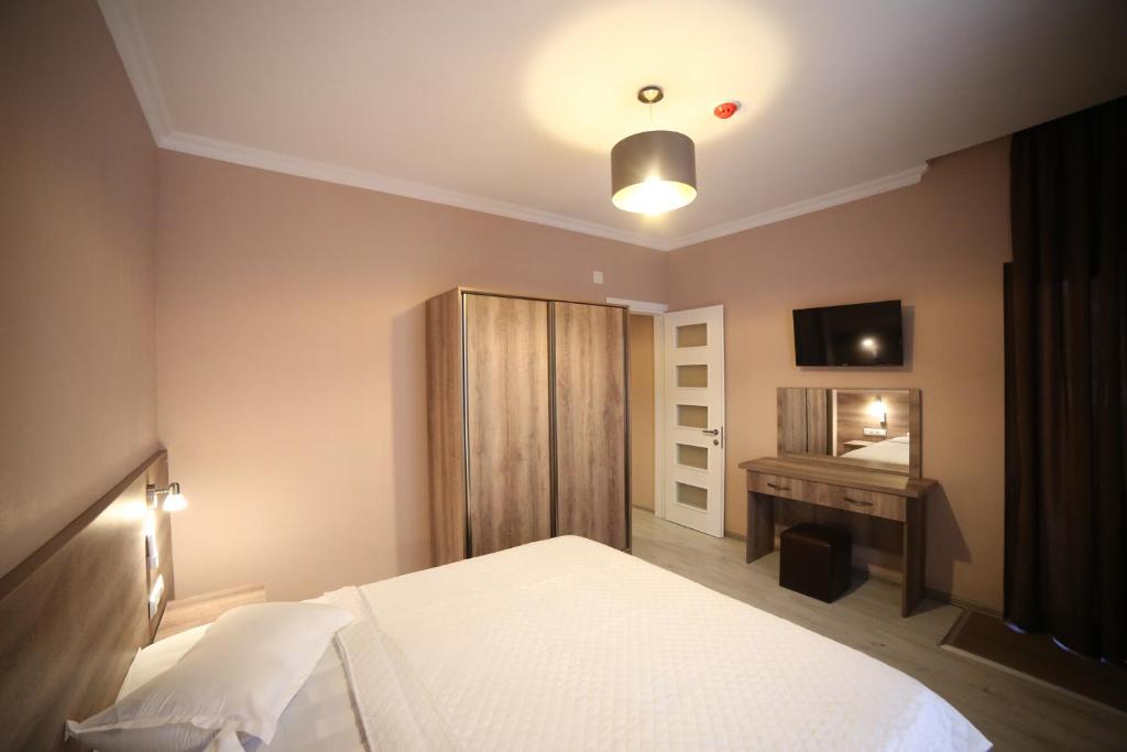 Postel nebo postele na pokoji v ubytování Hotel Soft