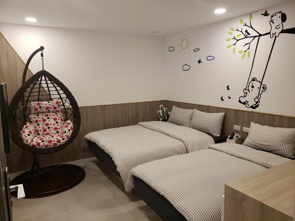 Postel nebo postele na pokoji v ubytování Chingya House