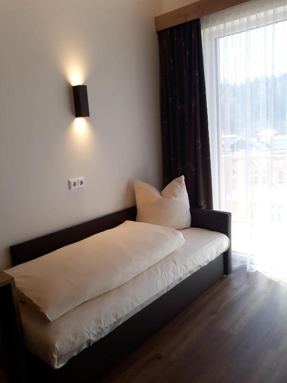 Postel nebo postele na pokoji v ubytování Hotel Jagdhof