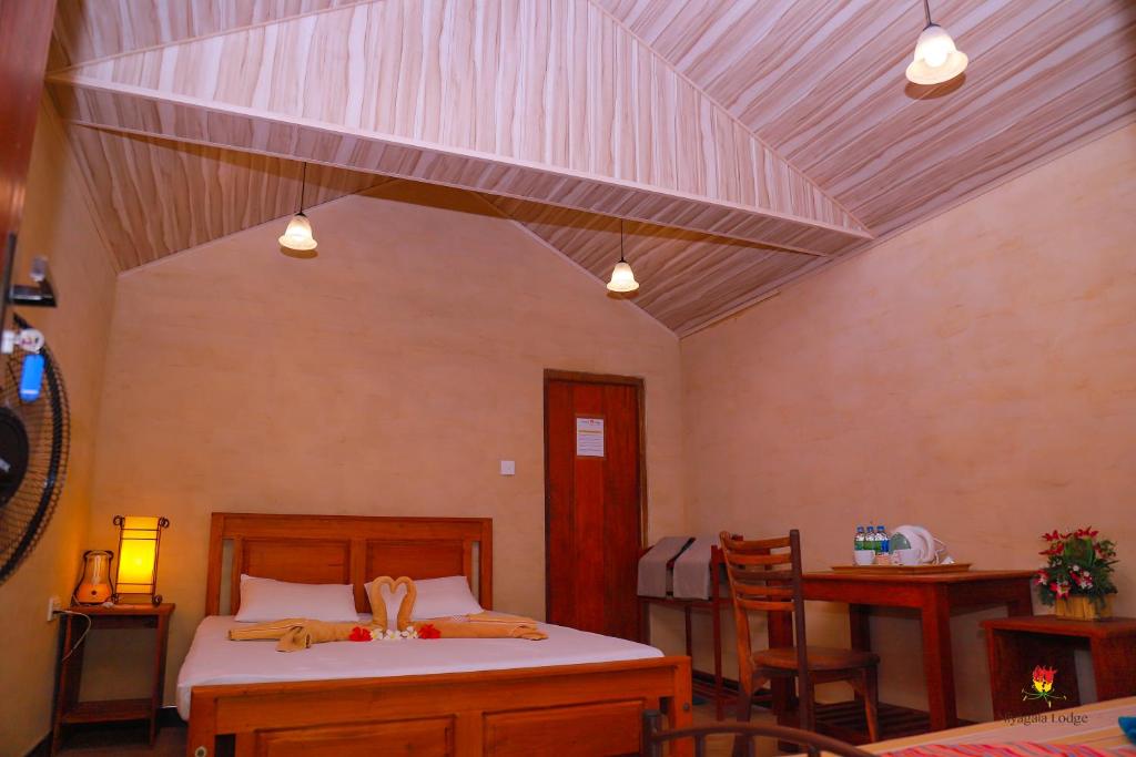 Postel nebo postele na pokoji v ubytování Hôtel Niyagala Lodge Sigiriya