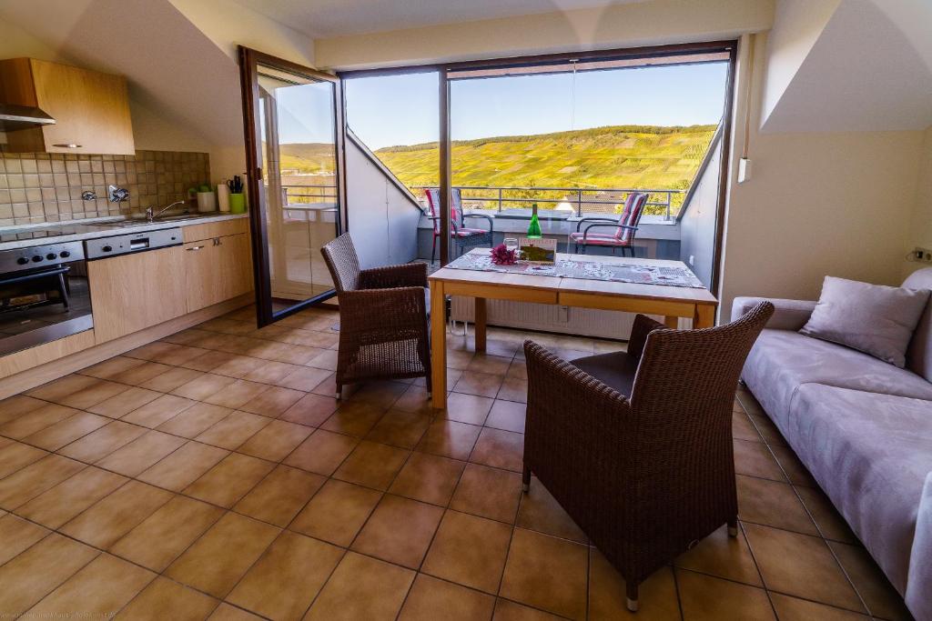 a living room with a couch and a table at Moseltalblick in Bernkastel-Kues