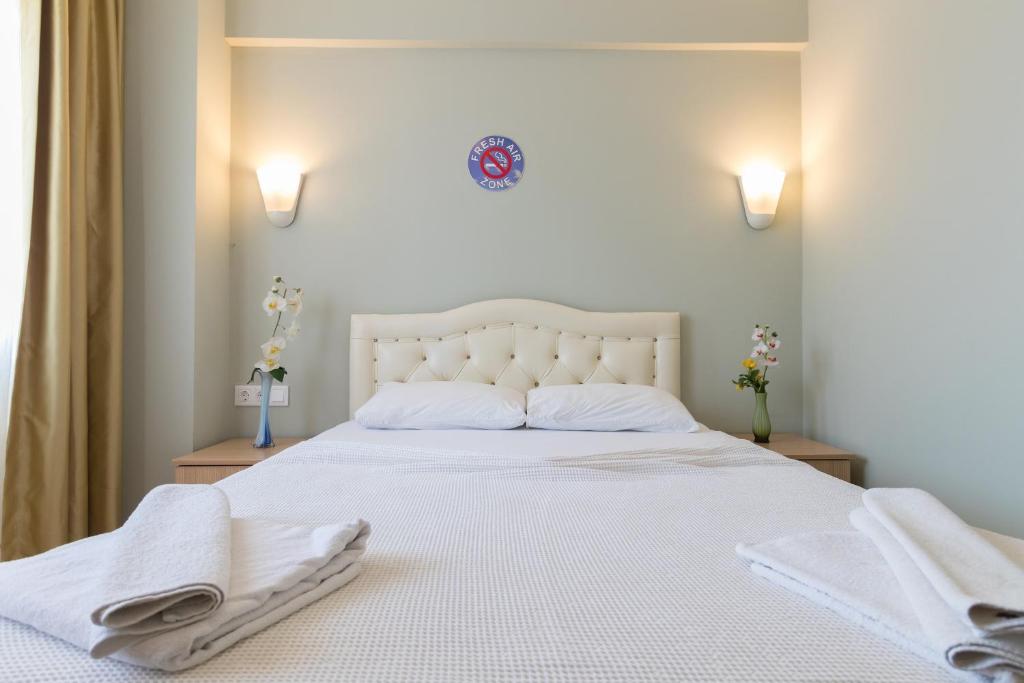 Postel nebo postele na pokoji v ubytování Hotel Dost