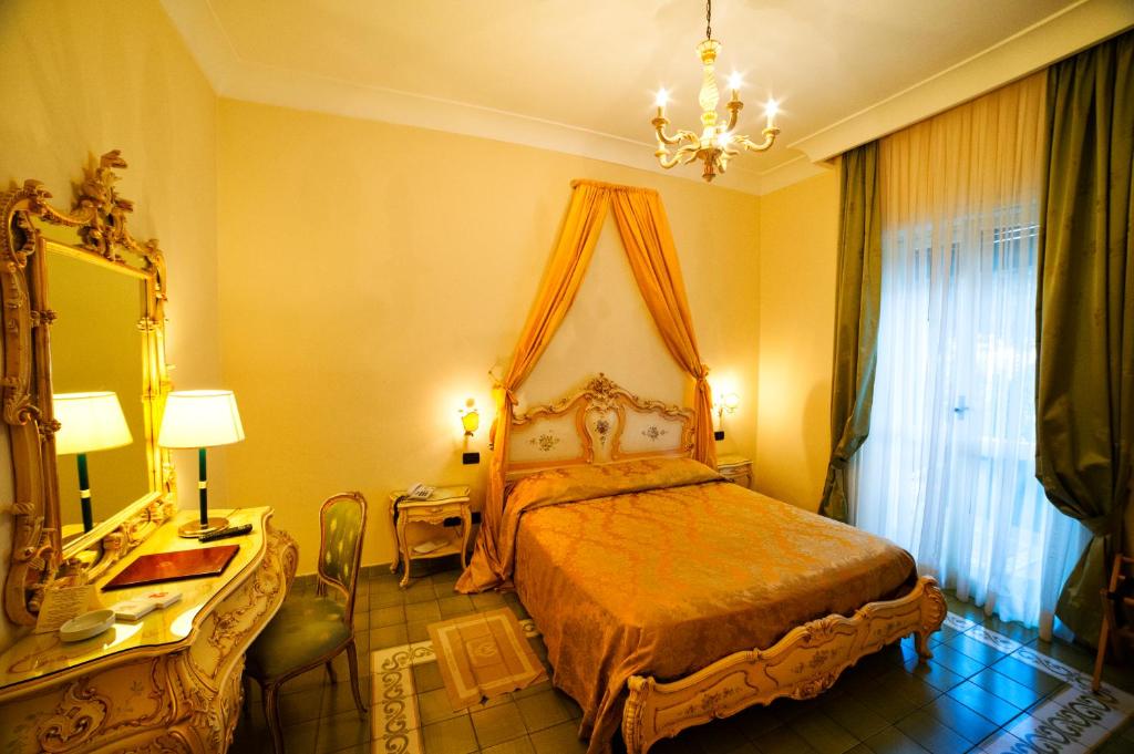 Postel nebo postele na pokoji v ubytování Grande Albergo Miramare