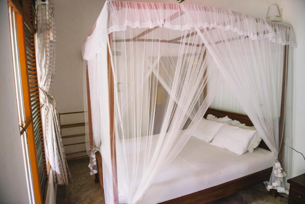 Postel nebo postele na pokoji v ubytování Kadolana Guest House