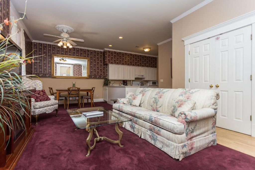 a living room with a couch and a table at Whiskey Row Penthouse in Prescott