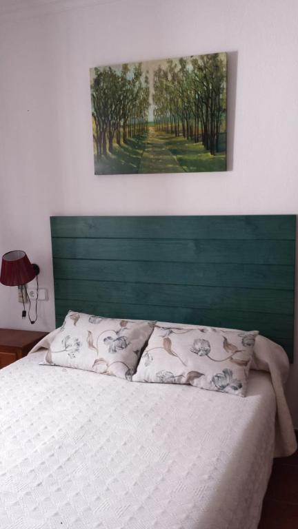 Postel nebo postele na pokoji v ubytování Pensión Venta Julián HCA01134