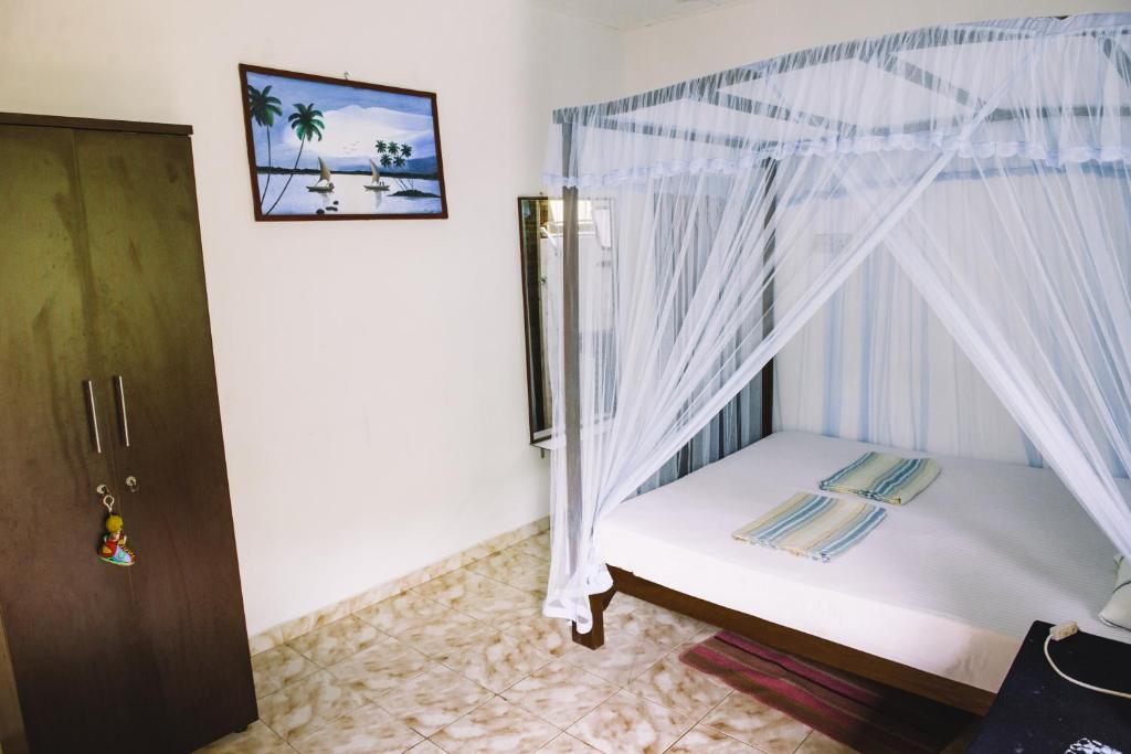 Postel nebo postele na pokoji v ubytování Kadolana Guest House