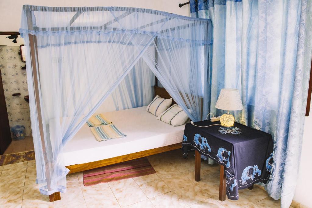 Postel nebo postele na pokoji v ubytování Kadolana Guest House
