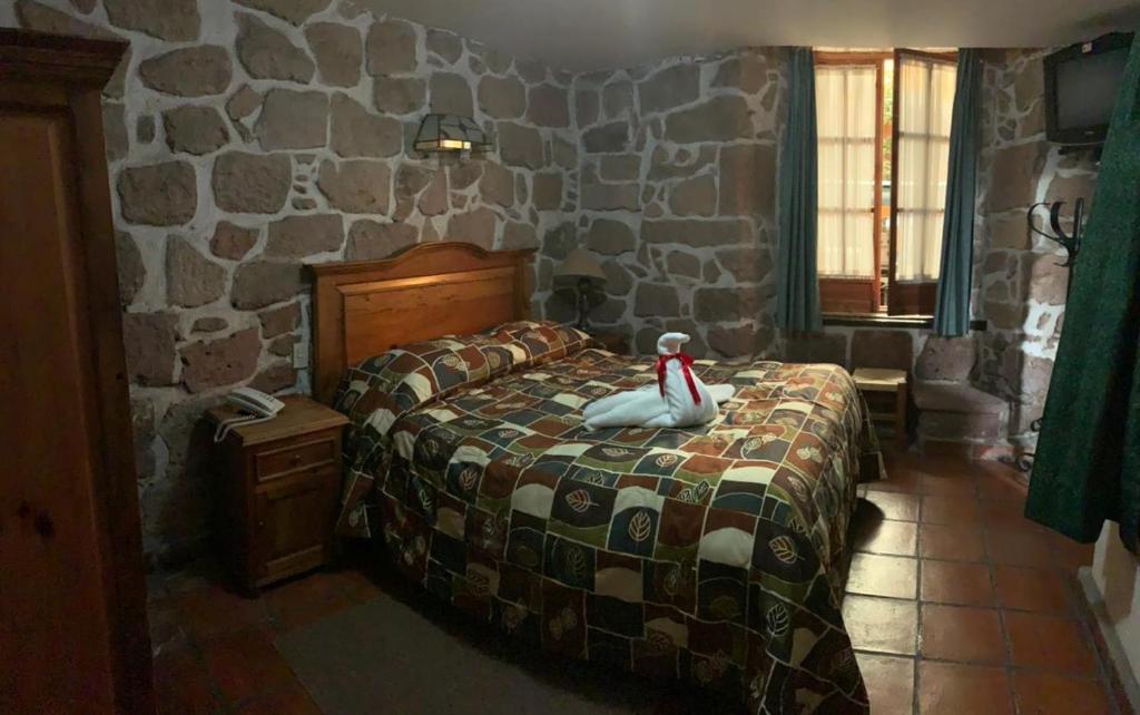Postel nebo postele na pokoji v ubytování Hotel Casa del Anticuario
