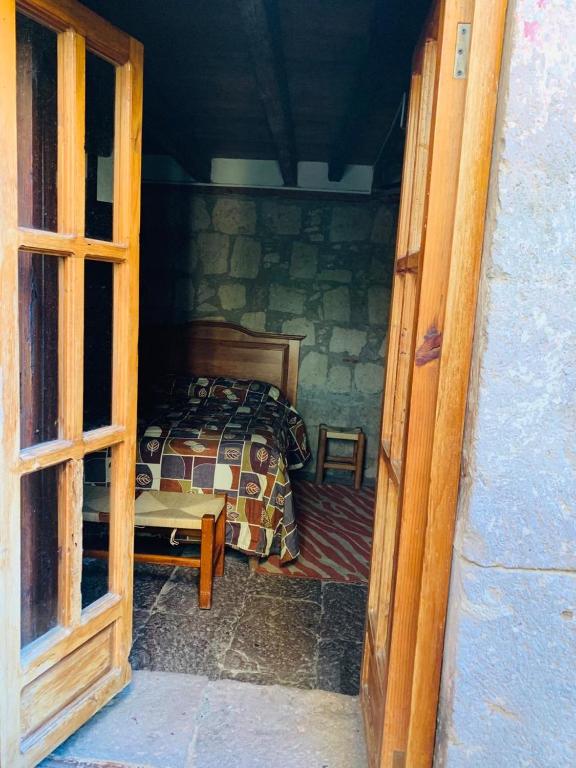 Postel nebo postele na pokoji v ubytování Hotel Casa del Anticuario