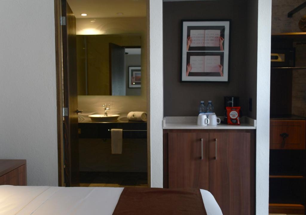 Postel nebo postele na pokoji v ubytování Hotel Ronda Minerva