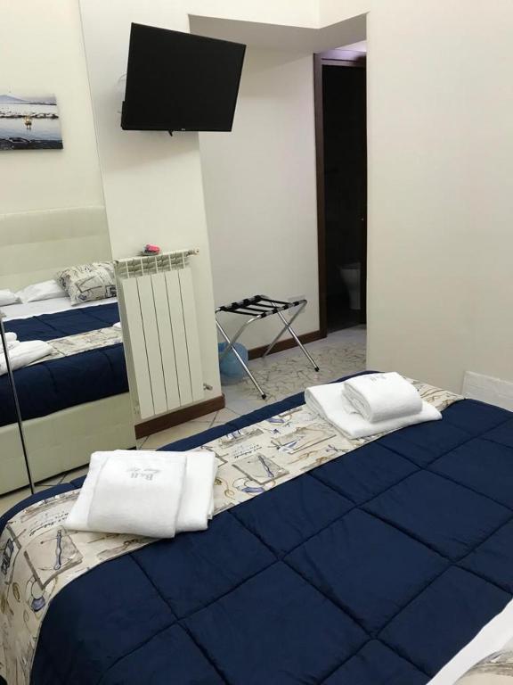 Łóżko lub łóżka w pokoju w obiekcie B&B Foria 210