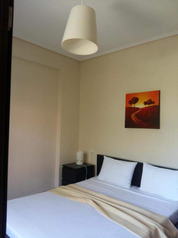 Postel nebo postele na pokoji v ubytování GOUGOUSIS apartments