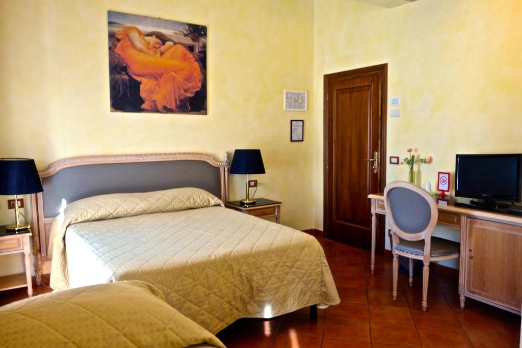 Posteľ alebo postele v izbe v ubytovaní Hotel Bologna