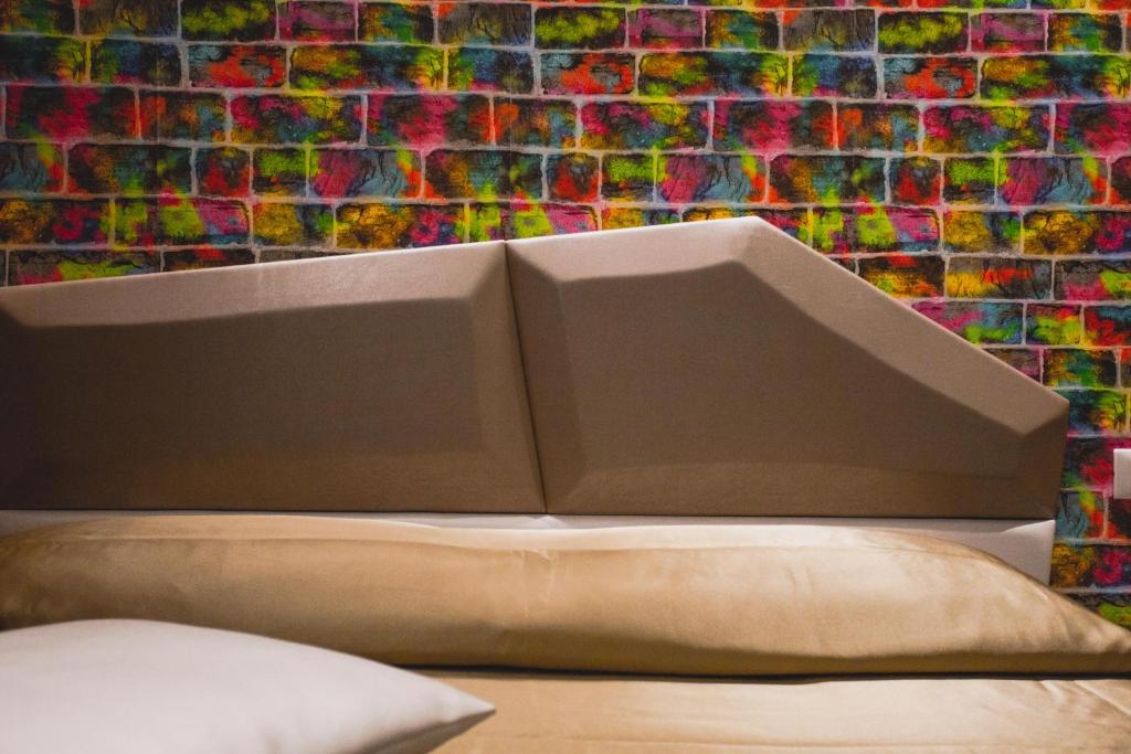 A bed or beds in a room at Hotel Fiera Wellness & Spa