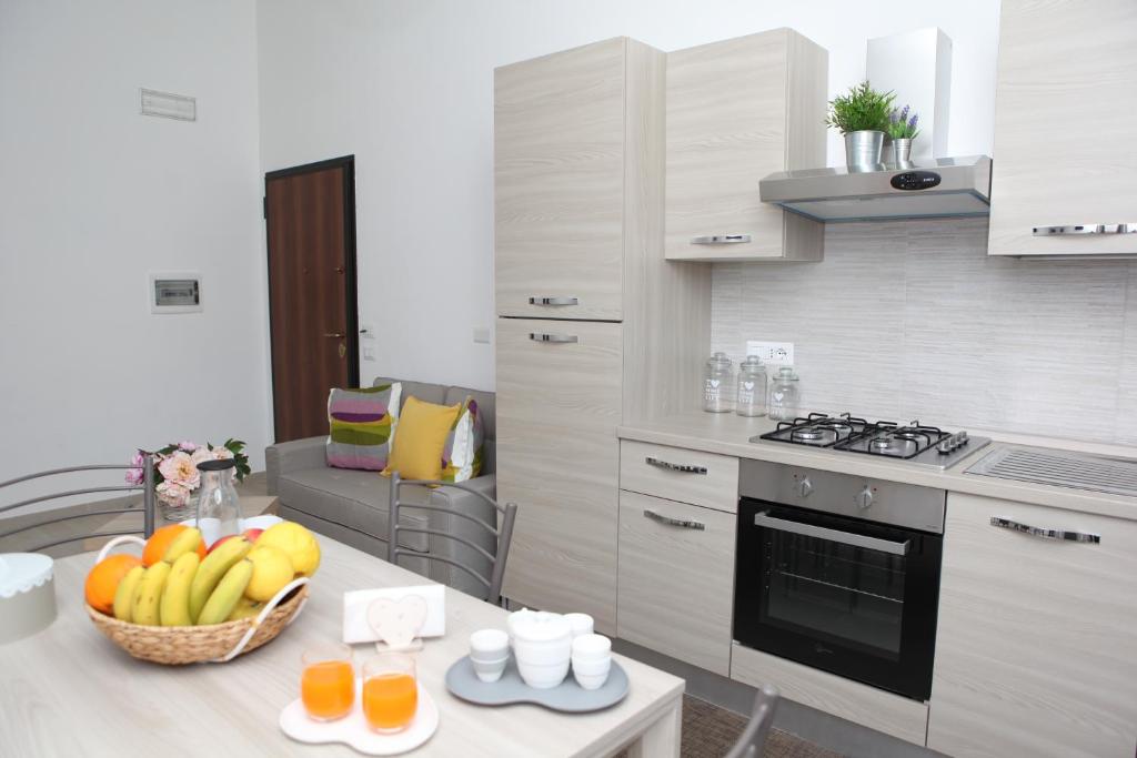A kitchen or kitchenette at Rosy House - Hospitality