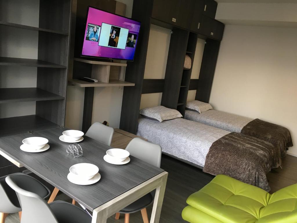 Voodi või voodid majutusasutuse Enjoy In Bogotá toas