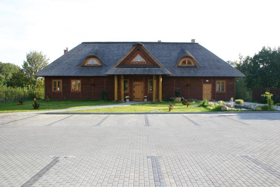 a large house with a driveway in front of it at Jasminum in Słupsk