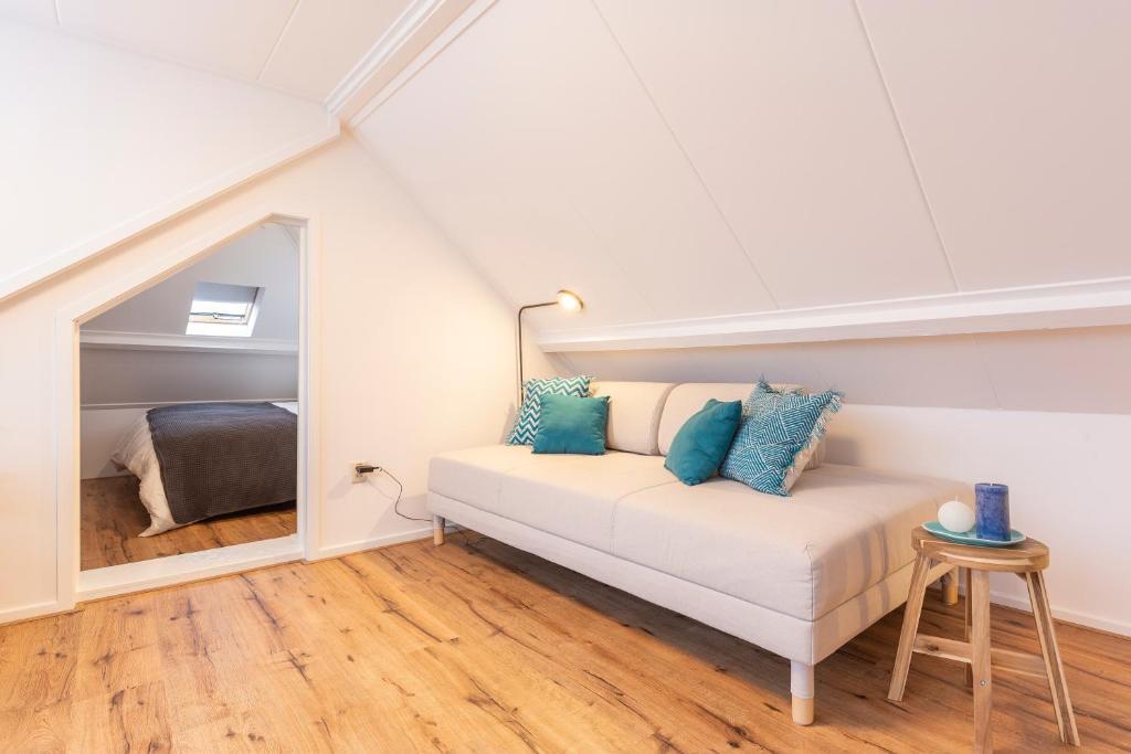 a room with a bed in a attic at Design City Center Family double floor apartment studio Delft C38 in Delft