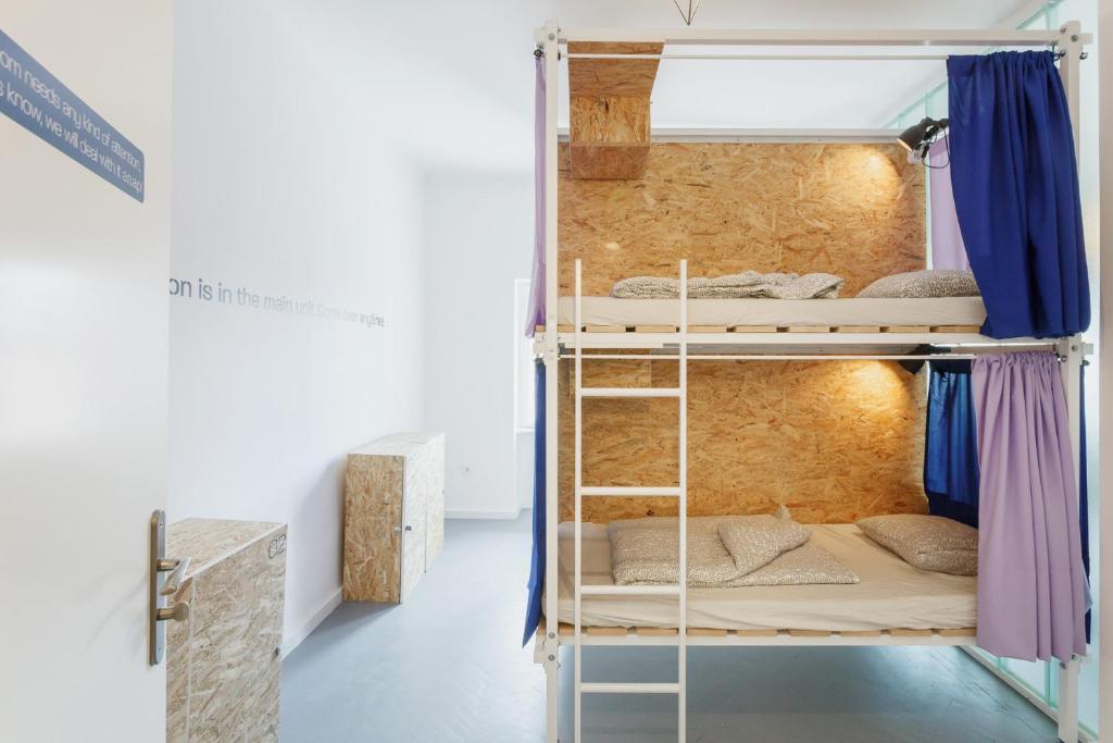 Postel nebo postele na pokoji v ubytování Avenue Hostel