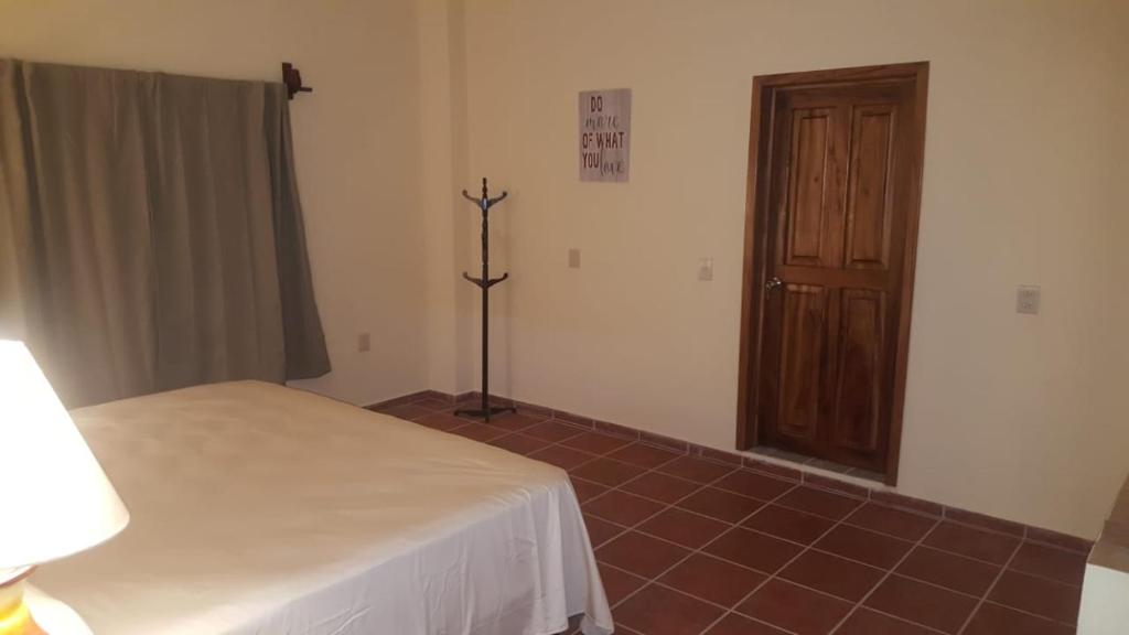 Postel nebo postele na pokoji v ubytování Casa palmito cerca de la playa