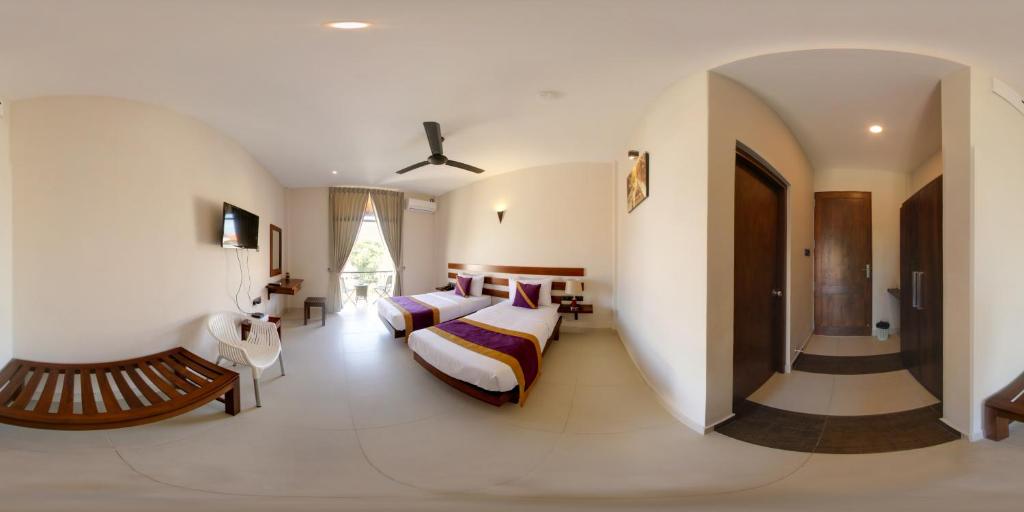 Postel nebo postele na pokoji v ubytování Hive 68 - Hotel and Resorts (Negombo)