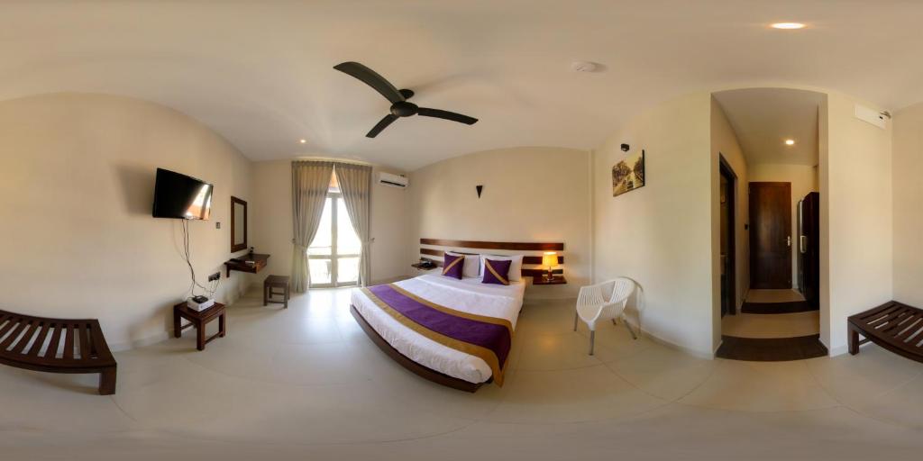 Postel nebo postele na pokoji v ubytování Hive 68 - Hotel and Resorts (Negombo)