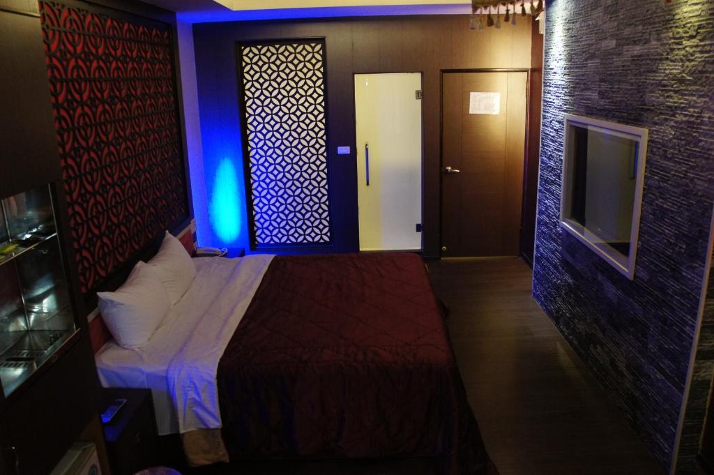 Postel nebo postele na pokoji v ubytování Paris Motel