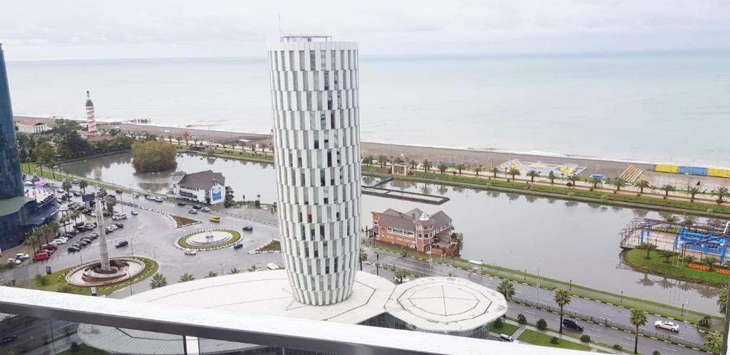 a view of a clock tower in a city at APARTMENT BATUMI BLACK PEARL in Batumi