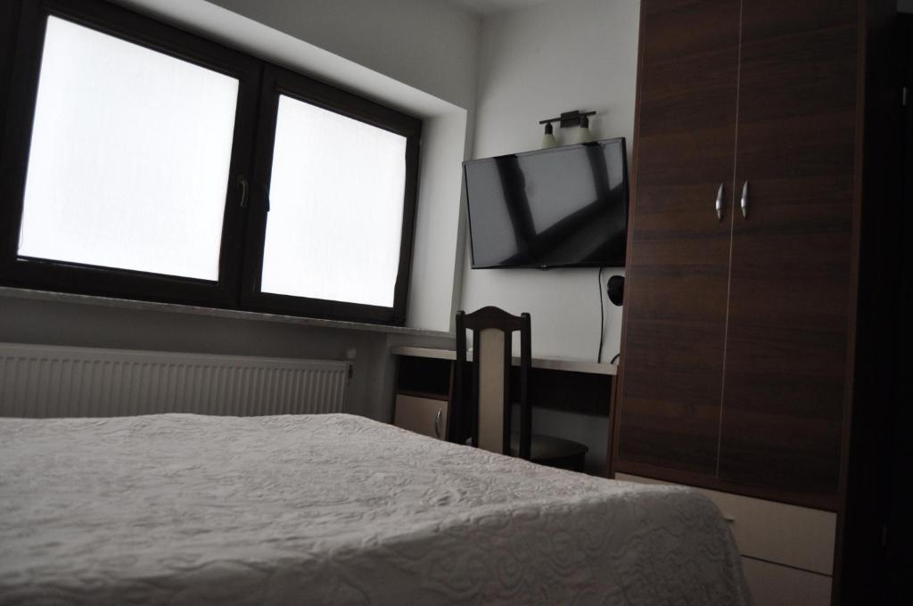 Postel nebo postele na pokoji v ubytování Prymus