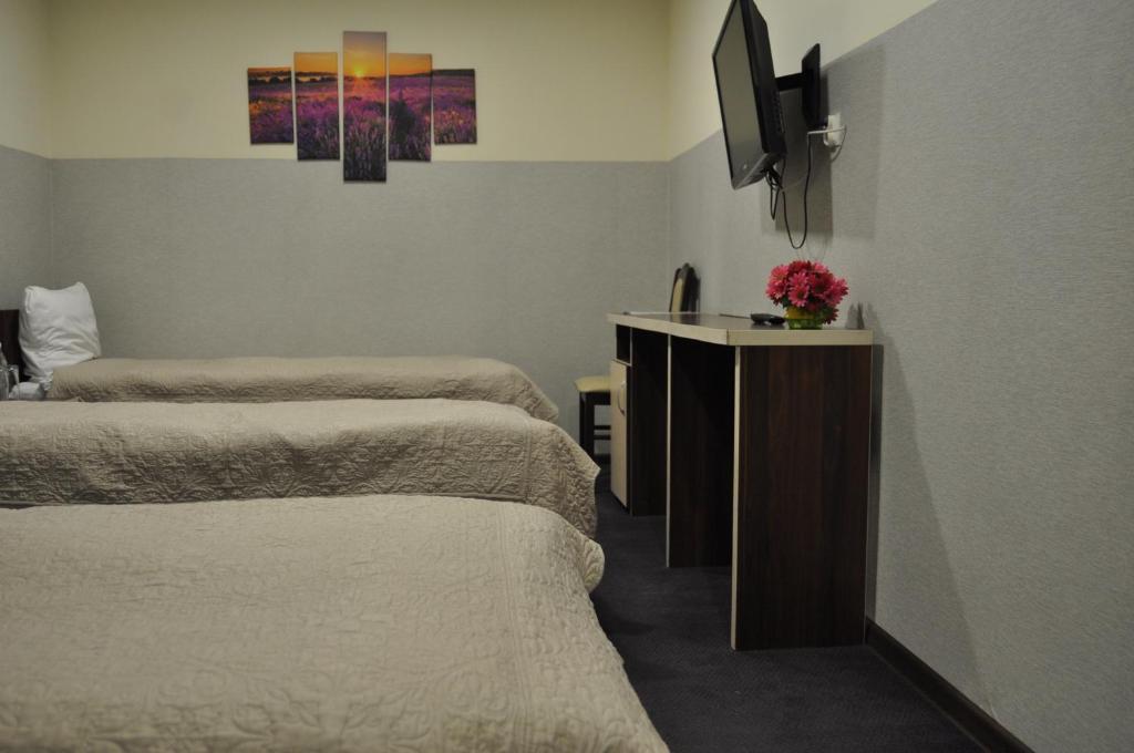 Postel nebo postele na pokoji v ubytování Prymus
