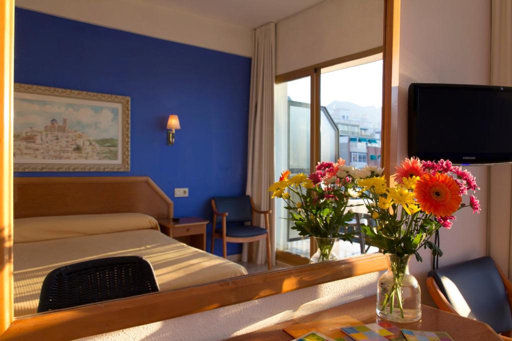 TV a/nebo společenská místnost v ubytování Hotel Colón