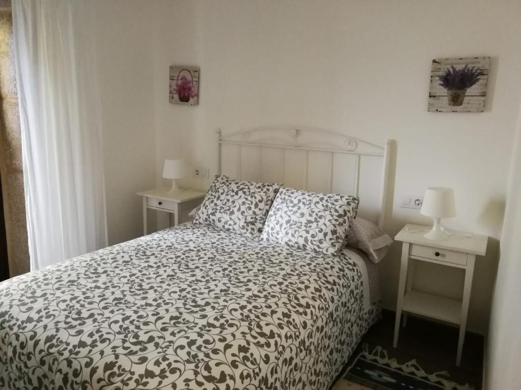 Postel nebo postele na pokoji v ubytování Casa rural Camelle Casa dos avós