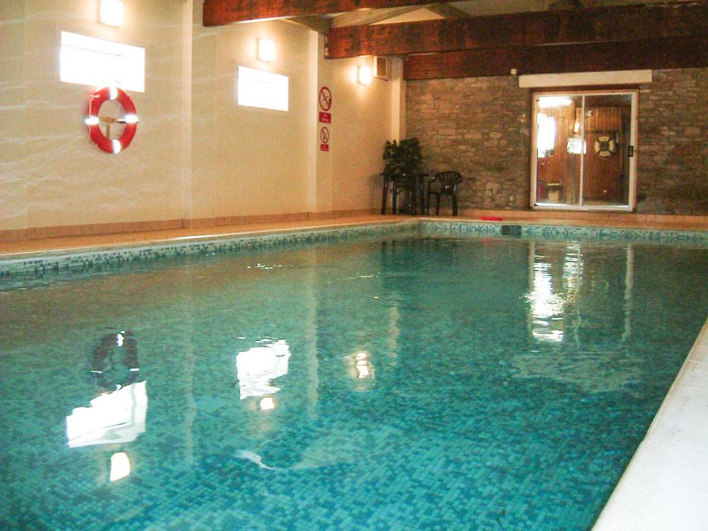 a large swimming pool in a building at Seven Stars in Hay-on-Wye