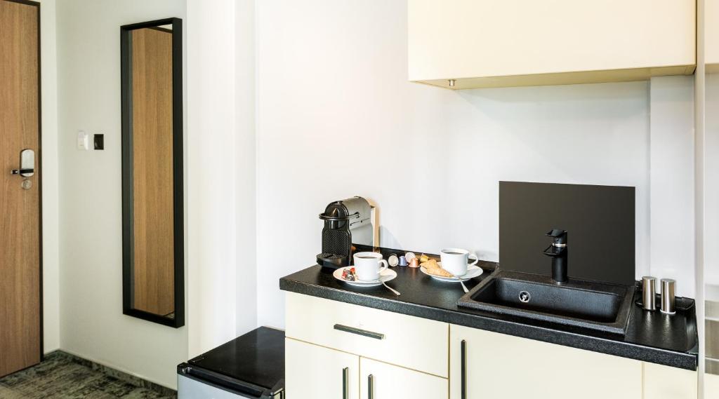 Kuchyňa alebo kuchynka v ubytovaní Camera Apartments
