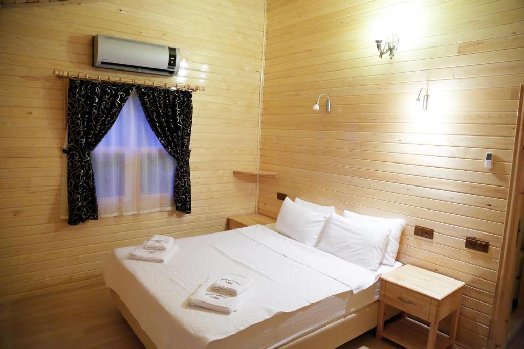 Postel nebo postele na pokoji v ubytování Mercan Bungalow