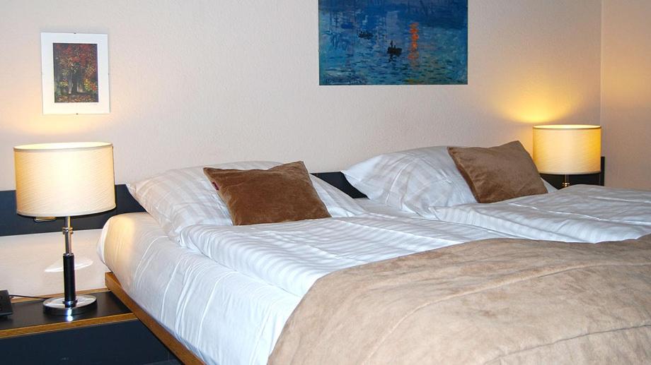 Postel nebo postele na pokoji v ubytování Hotel Central